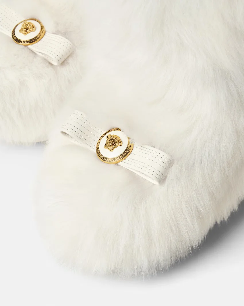 Valentino feathered boot and Chanel Coco Neige boot from the luxury collection.