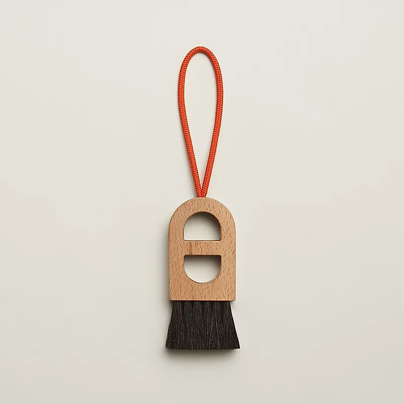 Close-up materials on a rare Hermes collector items review focusing on beech and sapelli wood