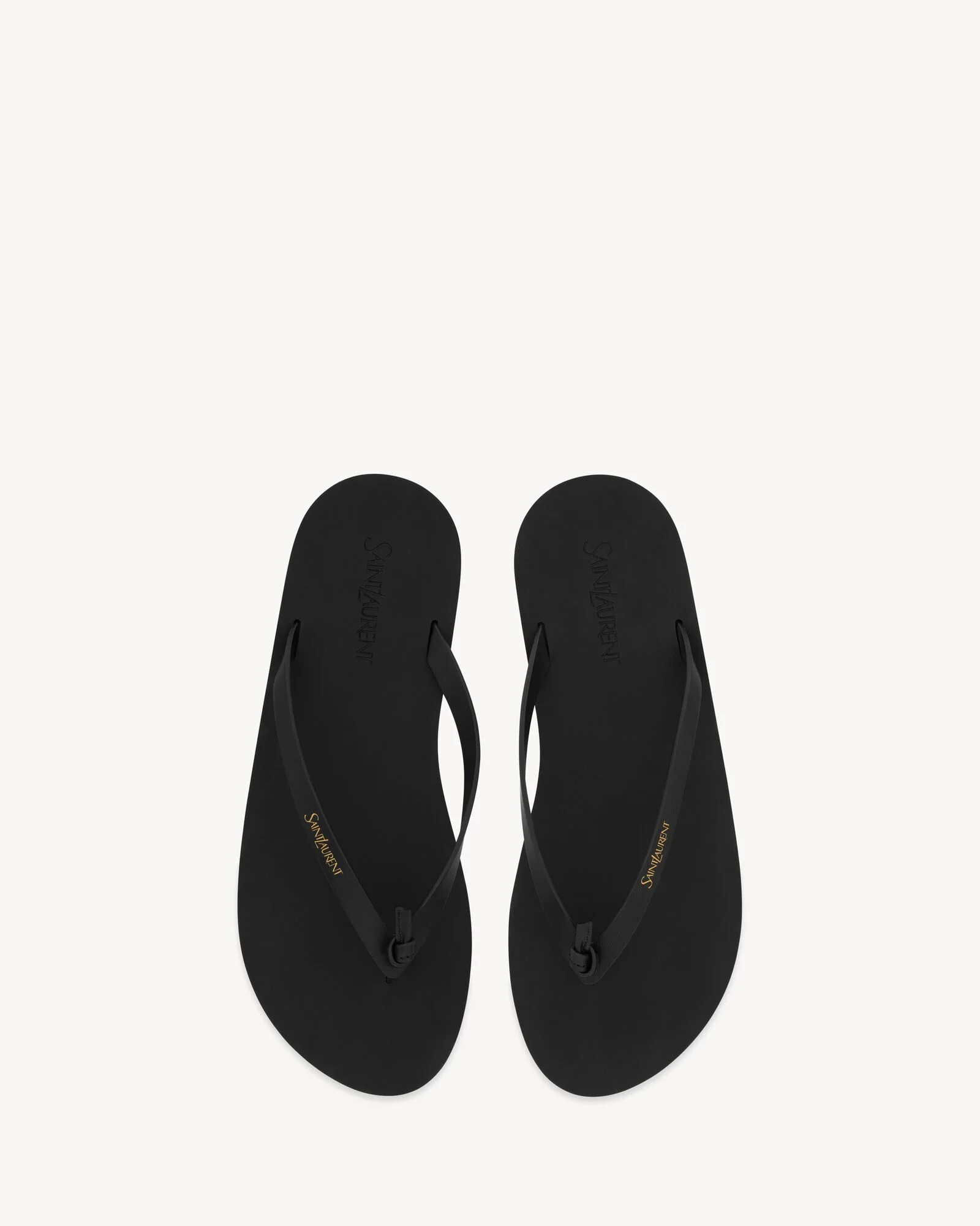 Exquisite knotted Y-strap details on a pair of premium designer flip flops women layout