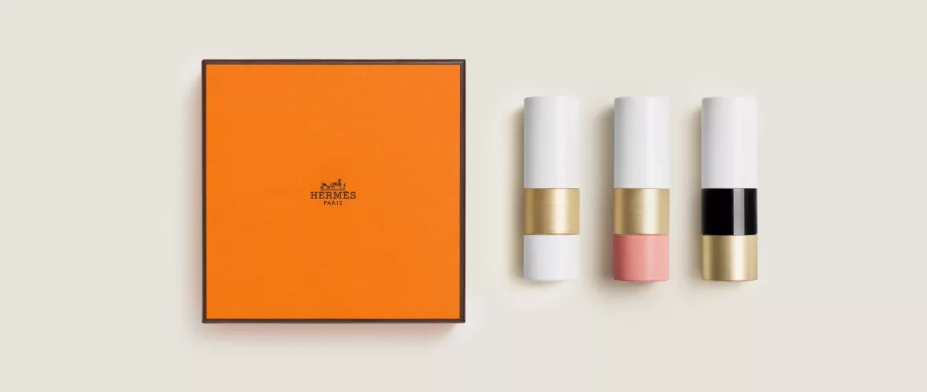 Hermès luxury brand with orange packaging and brown ribbon