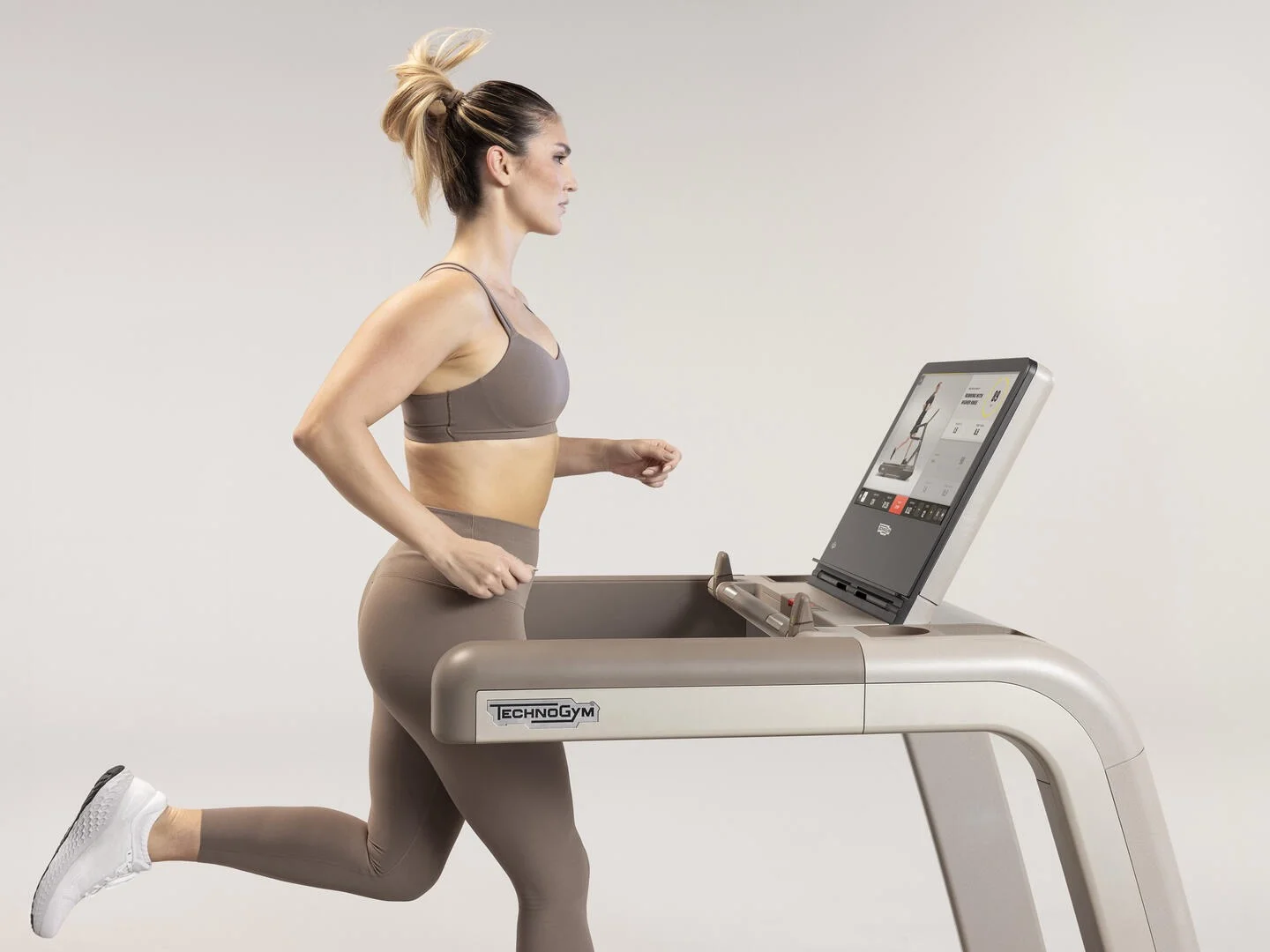 Close-up details of smart touchscreens on world class luxury fitness gear at a premium resort